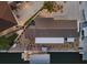 Aerial view of property with a boat dock, waterfront access, and landscaped backyard at 303 Bryn Mawr Is, Bradenton, FL 34207
