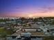Sunset aerial view of waterfront property, showcasing the home's location and surroundings at 303 Bryn Mawr Is, Bradenton, FL 34207