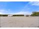 Sandy beach access point with wooden barriers and view of the water at 303 Bryn Mawr Is, Bradenton, FL 34207