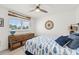 Nautical bedroom features a wooden dresser with blue fish bedding and compass decor at 303 Bryn Mawr Is, Bradenton, FL 34207