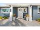 Inviting front porch with stylish lighting and a freshly paved walkway at 303 Bryn Mawr Is, Bradenton, FL 34207