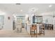Open-concept kitchen featuring a center island and views of dining area at 303 Bryn Mawr Is, Bradenton, FL 34207
