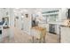 Bright kitchen featuring stainless steel appliances, white cabinets, and wood-look flooring at 303 Bryn Mawr Is, Bradenton, FL 34207