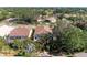 Aerial view of a single-Gathering home with mature trees and lush landscaping at 322 Langholm Dr, Venice, FL 34293
