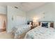 Bright bedroom featuring twin beds, shell decor and view of closet at 322 Langholm Dr, Venice, FL 34293
