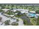 Beautiful community center with a pool, pond, and lush landscaping, creating a welcoming hub for residents to enjoy at 322 Langholm Dr, Venice, FL 34293