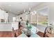 The dining area connects to the kitchen, offering a view of backyard at 322 Langholm Dr, Venice, FL 34293