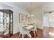 The coastal dining room has seating for four and access to the kitchen at 322 Langholm Dr, Venice, FL 34293