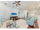 Spacious living room with hardwood floors, comfortable seating, and a view of the kitchen and dining area at 322 Langholm Dr, Venice, FL 34293