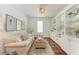 Bright living room featuring a sofa, built-in cabinets, and tasteful décor at 322 Langholm Dr, Venice, FL 34293