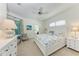 The spacious main bedroom features carpet flooring, natural light, and coastal decor at 322 Langholm Dr, Venice, FL 34293