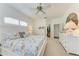 Large main bedroom with white furniture, carpet flooring, and bright lighting at 322 Langholm Dr, Venice, FL 34293