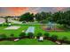 Charming community playground with basketball court, play structures, and lush green surroundings, ideal for outdoor fun at 322 Langholm Dr, Venice, FL 34293