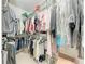 Spacious walk-in closet with organized storage for clothing and accessories at 322 Langholm Dr, Venice, FL 34293