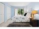 Serene bedroom with balcony access, soft lighting, and neutral color palette at 323 Timberlake Dr # 323, Bradenton, FL 34210