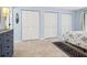 Light and airy bedroom showcasing three spacious closets for storage at 323 Timberlake Dr # 323, Bradenton, FL 34210