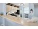 Functional kitchen featuring counter seating with sleek appliances and plentiful storage at 323 Timberlake Dr # 323, Bradenton, FL 34210