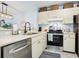 Well-lit kitchen featuring stainless steel appliances and ample countertop space at 323 Timberlake Dr # 323, Bradenton, FL 34210