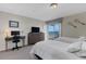 Bedroom with two beds and direct access to outdoor balcony at 3235 Gulf Of Mexico Dr # A305, Longboat Key, FL 34228