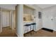 Stylish kitchen with seating, modern appliances, and neutral tones, offers plenty of storage at 3235 Gulf Of Mexico Dr # A305, Longboat Key, FL 34228