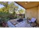 Serene backyard patio with beautiful landscaping and comfortable seating at 3457 Clark Rd # 156, Sarasota, FL 34231