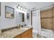 Well-maintained bathroom featuring a granite countertop and tiled shower at 3457 Clark Rd # 156, Sarasota, FL 34231