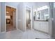 Hallway leading to a bathroom with modern white cabinets and a shower at 349 Blackbird Ct, Bradenton, FL 34212