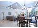 Open floor plan with dining area and large windows offering natural light and outdoor views at 349 Blackbird Ct, Bradenton, FL 34212