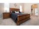 Comfortable main bedroom with an archway leading to the main bathroom, bedside tables, and modern finishes at 349 Blackbird Ct, Bradenton, FL 34212