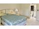 Bedroom with a serene atmosphere with a comfortable bed and an en-suite bathroom at 3500 El Conquistador Pkwy # 129, Bradenton, FL 34210