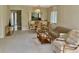 Open concept living space boasts dining area, comfortable seating, and a pass through to the kitchen at 3500 El Conquistador Pkwy # 129, Bradenton, FL 34210