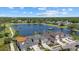 Stunning aerial view of the community, highlighting the homes and serene lake setting at 3664 Course Dr, Sarasota, FL 34232