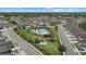 A high angle aerial view of a planned community with a pool, clubhouse, and sidewalks at 3664 Course Dr, Sarasota, FL 34232