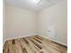 Bedroom featuring wood-look floors and a utility closet at 3664 Course Dr, Sarasota, FL 34232