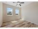 Bedroom with wood-look floors and a bright window view at 3664 Course Dr, Sarasota, FL 34232