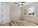 Bedroom with wood-look floors and a bright window view at 3664 Course Dr, Sarasota, FL 34232