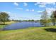 Enjoy the tranquil beauty of the lake with its lush green surroundings, perfect for relaxation and outdoor activities at 3664 Course Dr, Sarasota, FL 34232