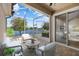 Relaxing screened patio with serene lake views, perfect for outdoor entertaining and enjoying the natural setting at 3664 Course Dr, Sarasota, FL 34232