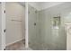 Modern bathroom with a sleek glass-enclosed shower and stylish tile, creating a spa-like experience at 3664 Course Dr, Sarasota, FL 34232