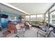 Enclosed lanai with hot tub and comfortable seating, perfect for relaxation at 404 62Nd Nw St, Bradenton, FL 34209