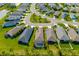 Aerial shot showcasing homes, manicured lawns, landscaping and a refreshing screened-in pool at 4162 Deep Creek Ter, Parrish, FL 34219