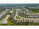 Aerial view of a planned community featuring numerous homes, interconnected lakes, and verdant landscaping at 4162 Deep Creek Ter, Parrish, FL 34219