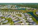 Aerial view of a residential community with lush green landscaping, serene lakes, and well-maintained homes at 4162 Deep Creek Ter, Parrish, FL 34219