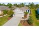 Aerial view of a well-landscaped home, driveway, and front yard at 4162 Deep Creek Ter, Parrish, FL 34219