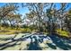 Community basketball court surrounded by lush greenery and shade trees at 4162 Deep Creek Ter, Parrish, FL 34219