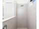 Tiled bathroom features shower and window at 4162 Deep Creek Ter, Parrish, FL 34219
