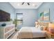 Bright bedroom with white linens, wicker furniture, and coastal decor, creating a serene atmosphere at 4162 Deep Creek Ter, Parrish, FL 34219