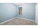Cozy bedroom with a window, neutral carpet, and freshly painted walls at 4162 Deep Creek Ter, Parrish, FL 34219