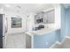 Well-lit kitchen features a breakfast bar, modern stainless steel appliances and ample cabinet space at 4162 Deep Creek Ter, Parrish, FL 34219