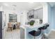 Modern kitchen with breakfast nook, stainless steel appliances, breakfast bar, and pendant lighting at 4162 Deep Creek Ter, Parrish, FL 34219